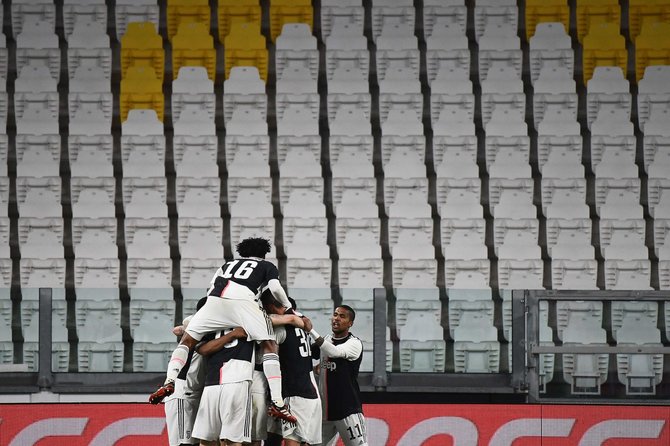 AFP/„Scanpix“ nuotr./Turino „Juventus“ triumfuoja po įvarčio tuščiame stadione