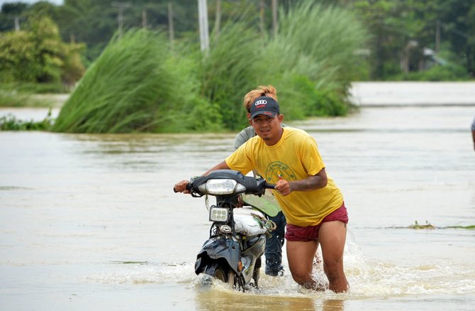 AFP/„Scanpix“ nuotr./Potvynis Mianmare