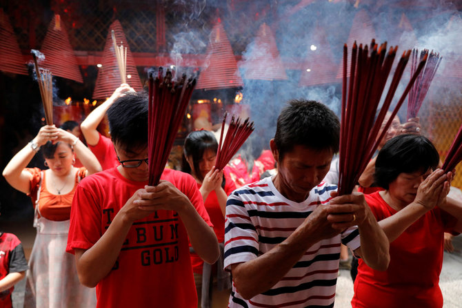 „Reuters“/„Scanpix“ nuotr./Kinų bendruomenės visame pasaulyje sutinka Kiaulės metus