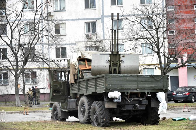 AFP/„Scanpix“ nuotr./Rusų karinis sunkvežimis po susišaudymo
