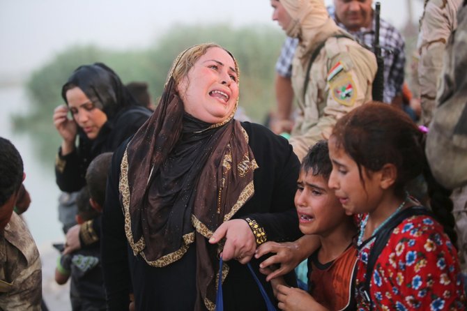 „Reuters“/„Scanpix“ nuotr./Pabėgeliai iš Ramadžio miesto Irake