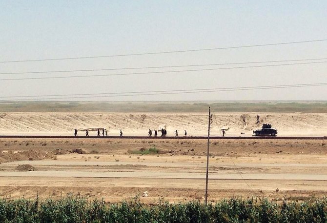 „Scanpix“/AP nuotr./Irako kariuomenė traukiasi iš Ramadžio regiono