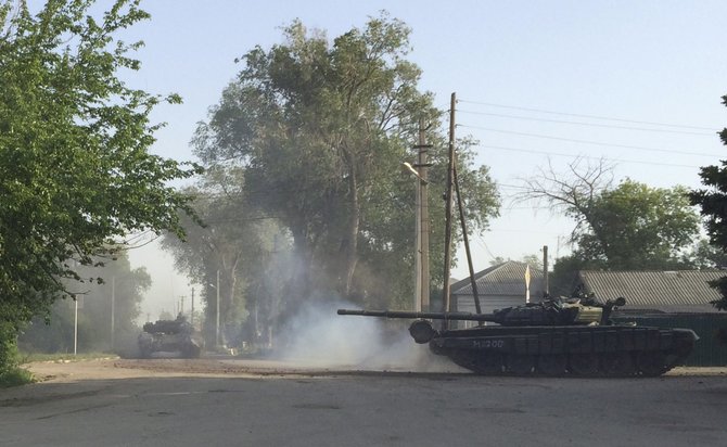 „Reuters“/„Scanpix“ nuotr./Miesto gatvėmis važinėjantis tankas