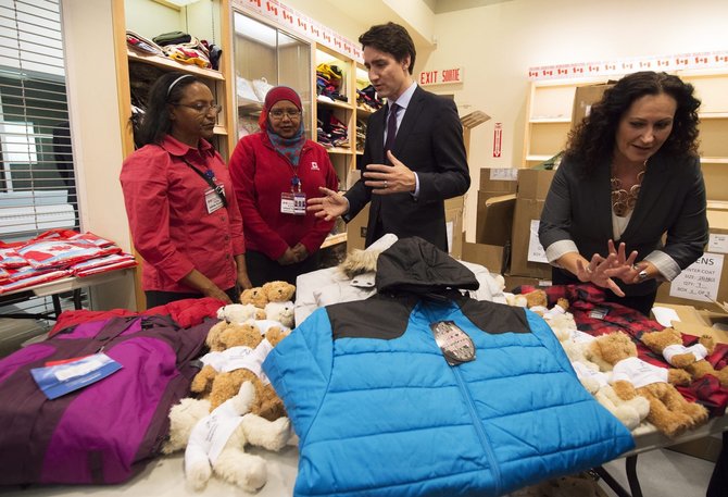 „Scanpix“/AP nuotr./Kanadą pasiekė pirmoji pabėgėlių iš Sirijos grupė