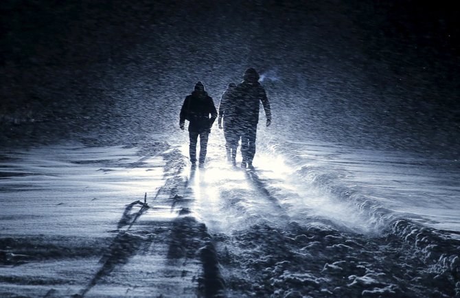 „Reuters“/„Scanpix“ nuotr./Vyrai keliauja per pūgą Rusijoje