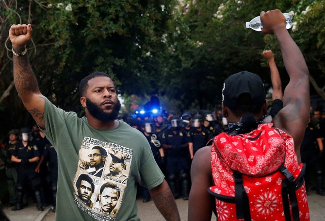 „Reuters“/„Scanpix“ nuotr./Protestai JAV dėl policijos smurto prieš juodaodžius