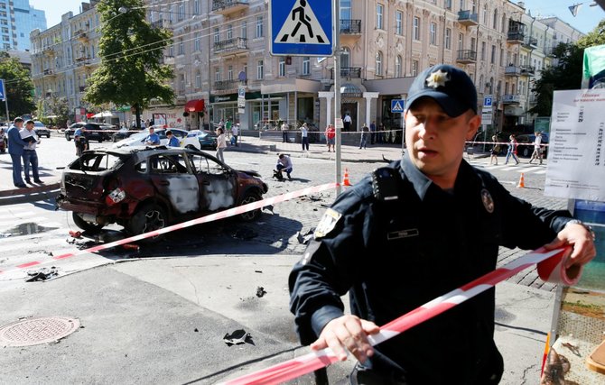 „Reuters“/„Scanpix“ nuotr./Kijevo centre sprogus automobiliui žuvo žurnalistas Pavelas Šeremetas