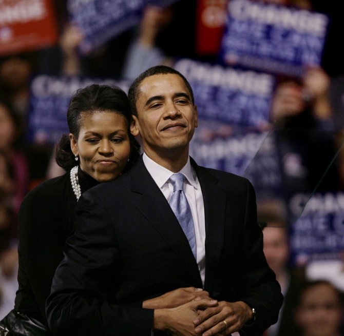 „Scanpix“/AP nuotr./Barackas Obama su žmona Michelle
