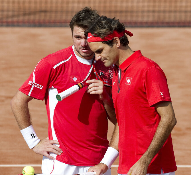 AFP/„Scanpix“ nuotr./Stanas Wawrinka ir Rogeris Federeris