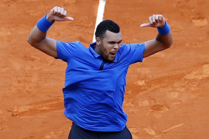 „Scanpix“ nuotr./Jo-Wilfriedas Tsonga prieš Pablo Carreno-Bustą