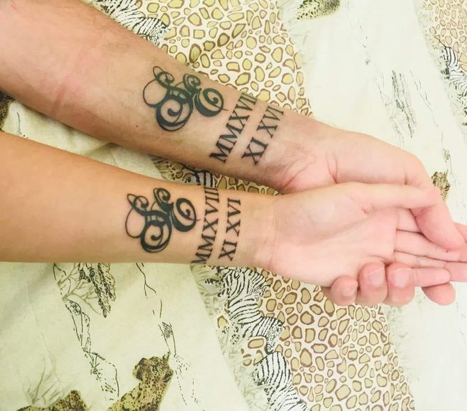 „Facebook“ nuotr./Sigitas Martinavičius ir Edita Rupeikaitė pasidarė identiškas tatuiruotes