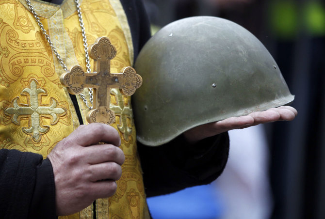 „Reuters“/„Scanpix“ nuotr./Fronte žuvusio Ukrainos kario laidotuvės