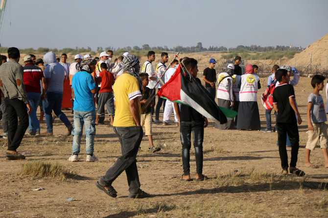 „Scanpix“/„SIPA“ nuotr./Palestiniečių protestuotojai prie Izraelio sienos su Gazos Ruožu