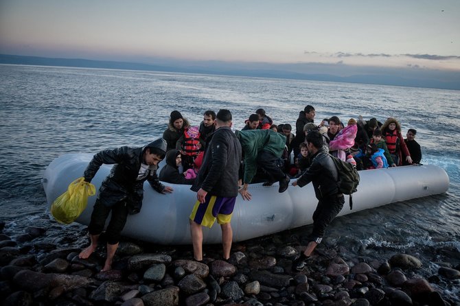 ZUMAPRESS / Scanpix nuotr./Migrantai iš Afganistano Graikijos Lesbo saloje