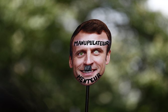 AFP/„Scanpix“ nuotr./Protestai prieš E.Macroną ir COVID-19 pasą Prancūzijoje