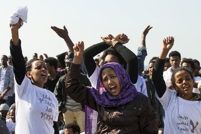 AFP/„Scanpix“ nuotr./Nelegalūs imigrantai iš Afrikos Izraelyje