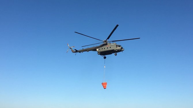 Karinių oro pajėgų / V.Urbono nuotr./Lietuvos karo lakūnai baigė gesinti miškų gaisrus Švedijoje