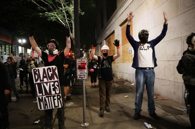 AFP/„Scanpix“ nuotr./Protestuotojai Portlande