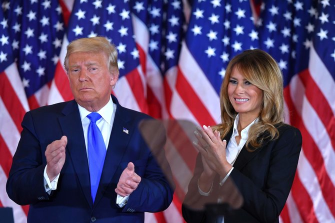 AFP/„Scanpix“ nuotr./Donaldas Trumpas su žmona Melania