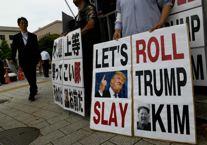 AFP/„Scanpix“ nuotr./Donaldo Trumpo ir Kim Jong Uno susitikimas