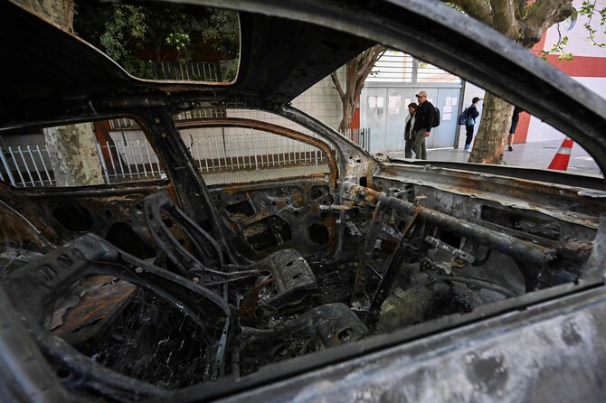 AFP/&bdquo;Scanpix&ldquo; nuotr./Sudegintas automobilis, kuriuo, kaip įtariama, vežtos Brenda del Castillo, Morena Verdi ir Lara Gutierrez