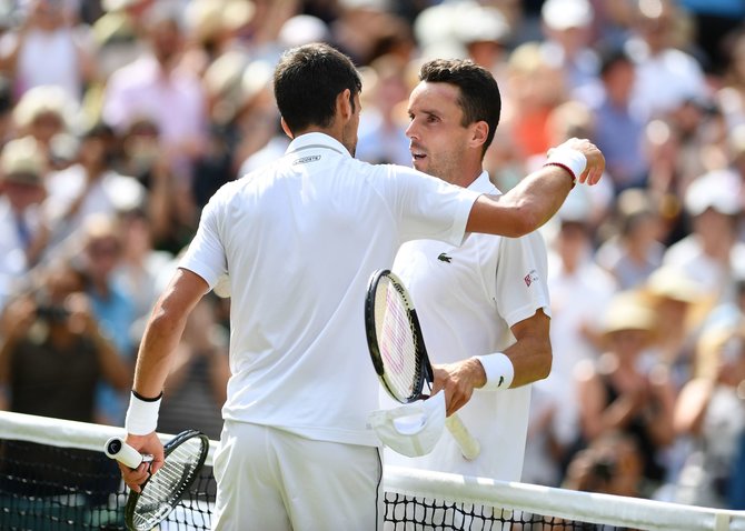 AFP/„Scanpix“ nuotr./Novakas Džokovičius ir Roberto Bautista-Agutas