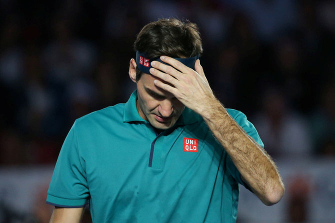 „Reuters“/„Scanpix“ nuotr./Rogeris Federeris su „Uniqlo“ marškinėliais