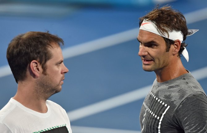AFP/„Scanpix“ nuotr./Rogeris Federeris su savo tautiečiu Severinu Luthi kartu dirbo nuo 2007 metų