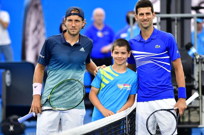 „Scanpix“ nuotr./Lucas Pouille ir Novakas Džokovičius 2019 metais „Australian Open“ pusfinalyje