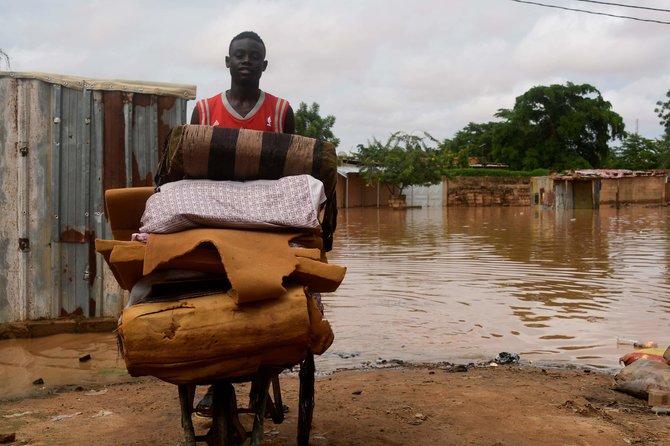 AFP/„Scanpix“ nuotr./Nigeryje potvyniai užliejo sostinę
