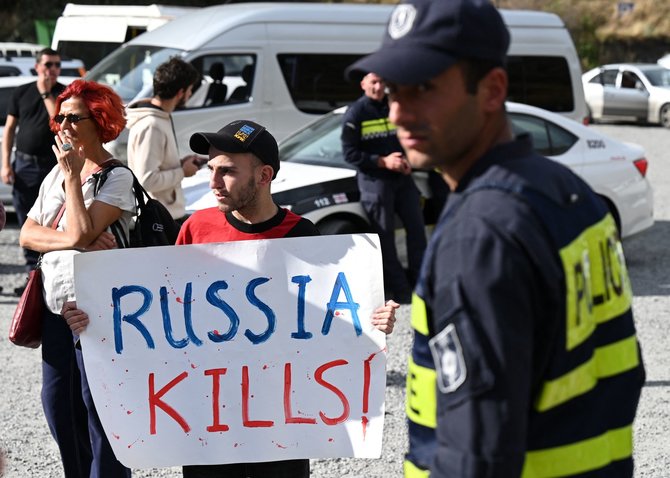 AFP/„Scanpix“ nuotr./Sakartvele surengtas protestas prieš išaugusią rusų imigraciją