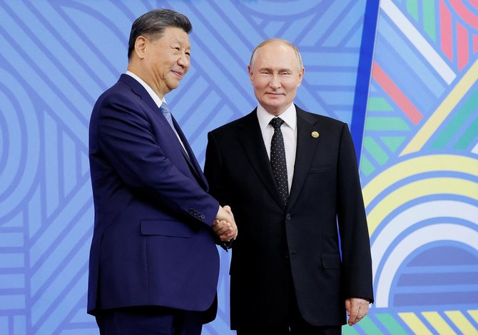 Xi Jinpingas su V. Putinu / Maxim Shemetov / REUTERS