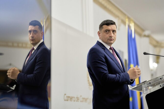 George Simionas / Vadim Ghirda / AP