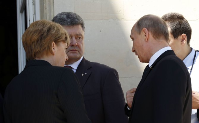 „Reuters“/„Scanpix“ nuotr./P.Porošenko ir V.Putinas