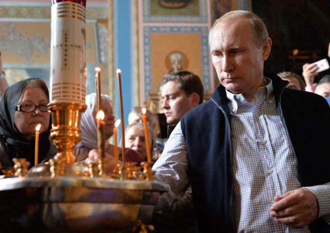 AFP/„Scanpix“ nuotr./V.Putinas komunizmas panašus į krikščionybę