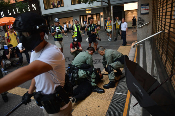 AFP/„Scanpix“ nuotr./Protestai Honkonge