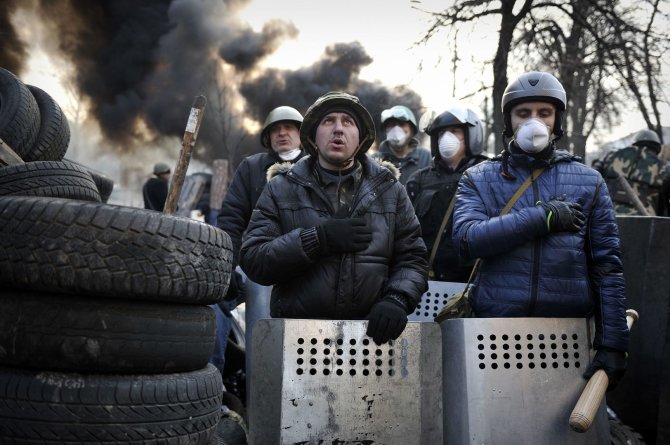 AFP/„Scanpix“ nuotr./Protestuotojai Kijeve