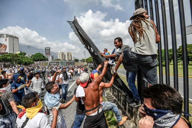 AFP/„Scanpix“ nuotr./Demonstracija Venesueloje