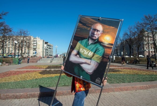 AFP/„Scanpix“ nuotr./Paveikslas su Vladimiro Putino portretu 