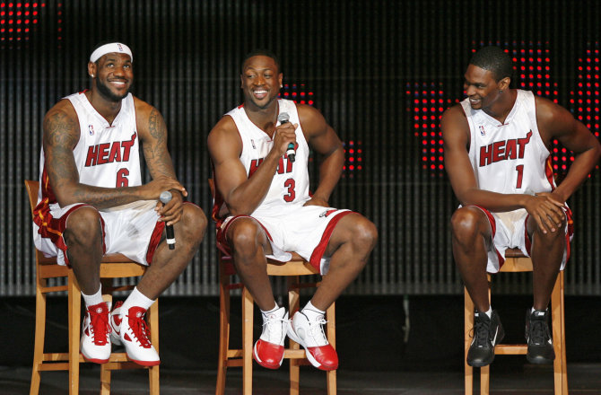 AFP/„Scanpix“ nuotr./LeBronas Jamesas, Dwyane'as Wade'as ir Chrisas Boshas