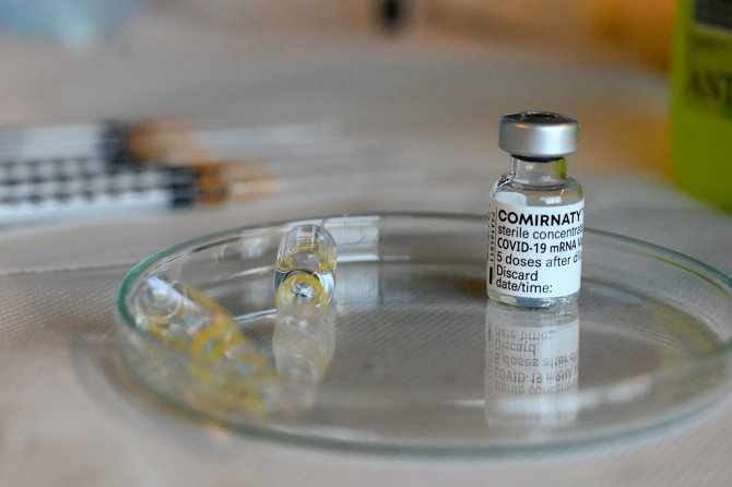 AFP/„Scanpix“ nuotr./Vakcina nuo COVID-19