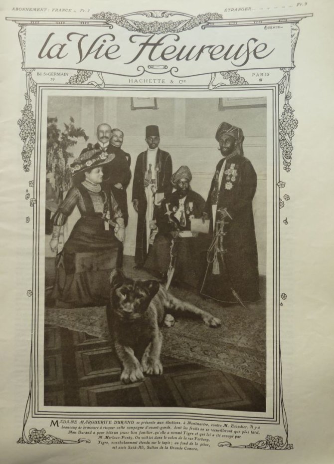 Wikimedia Commons nuotr./Ant populiaraus žurnalo Laimingas gyvenimas viršelio – M.Durand su liūtu