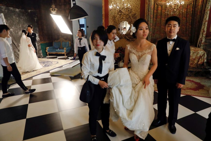 „Reuters“/„Scanpix“ nuotr./Vestuvės Kinijoje