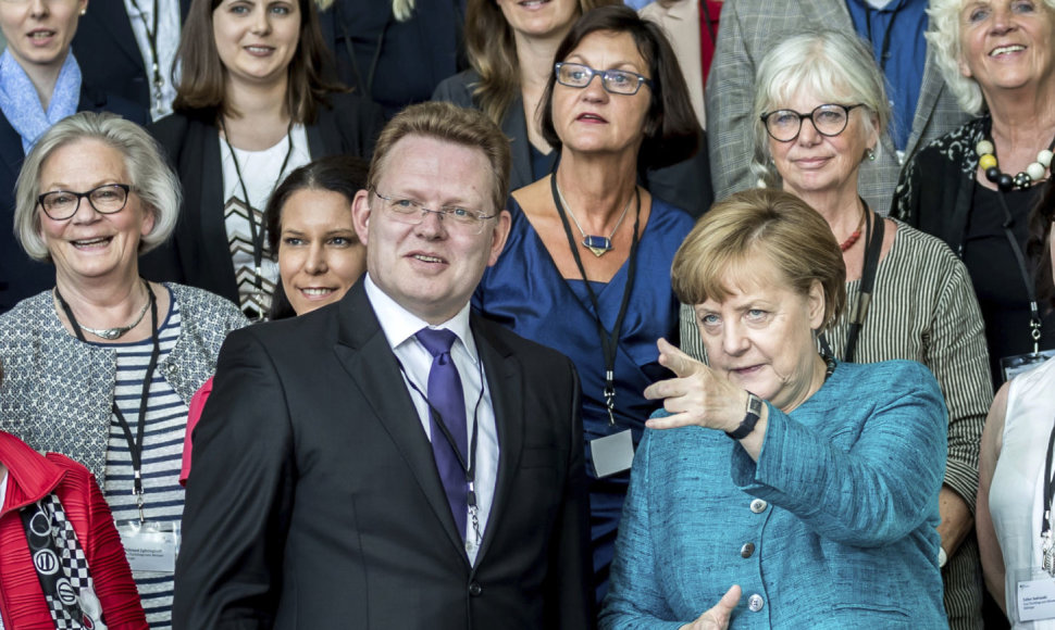 Andreas Hollsteinas ir Angela Merkel