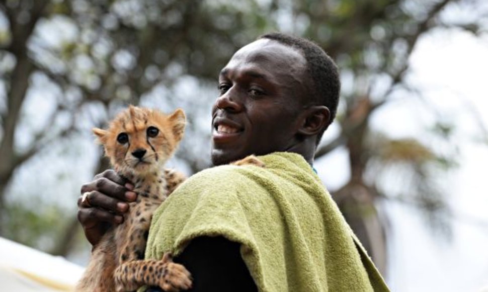 Usainas Boltas su gepardo jaunikliu