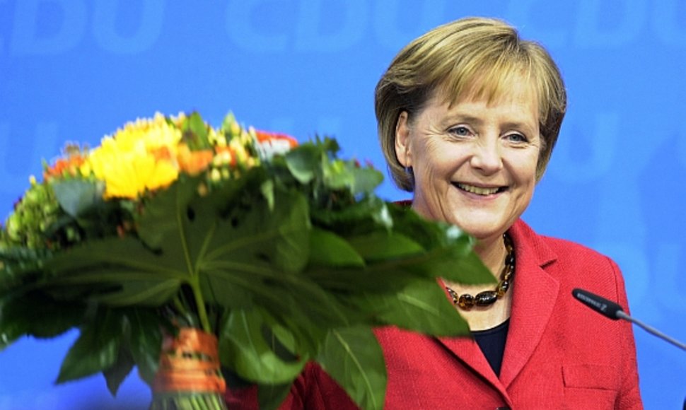 Angela Merkel švenčia pergalę.