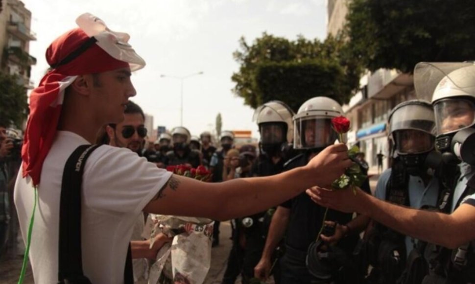 Protestors giving policemen flowers