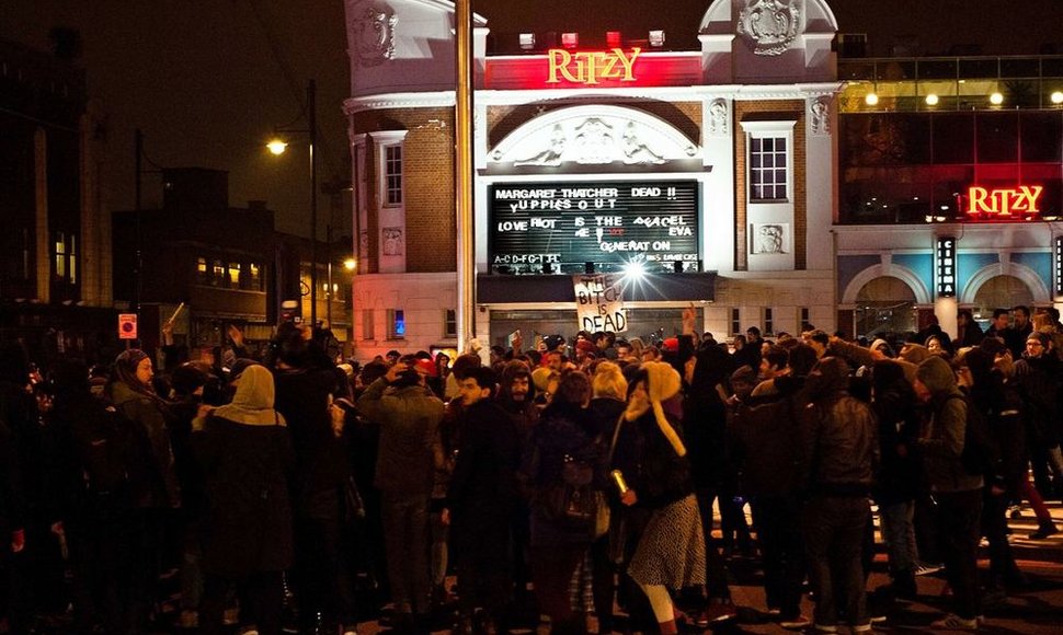 The letters on the outside of the Ritzy cinema are re-arranged in south London, in the early hours of April 9, 2013, to read 'Margaret Thatcher Dead!!' during a 'party' to celebrate the death of former British Prime Minister Margaret Thatcher. Britain wrestled Tuesday with violent passions ignited b