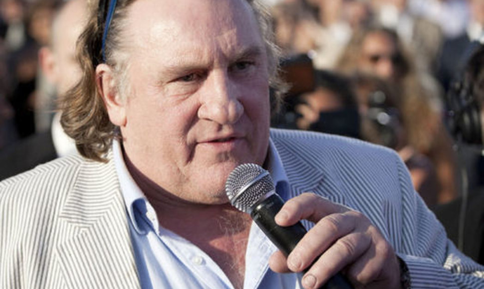 French actor Gerard Depardieu gives a speech during the baptism of the new French MSC Divina, a new cruise vessel, on May 26, 2012 at the Marseille harbour, southern France. AFP PHOTO / VINCENT BEAUME