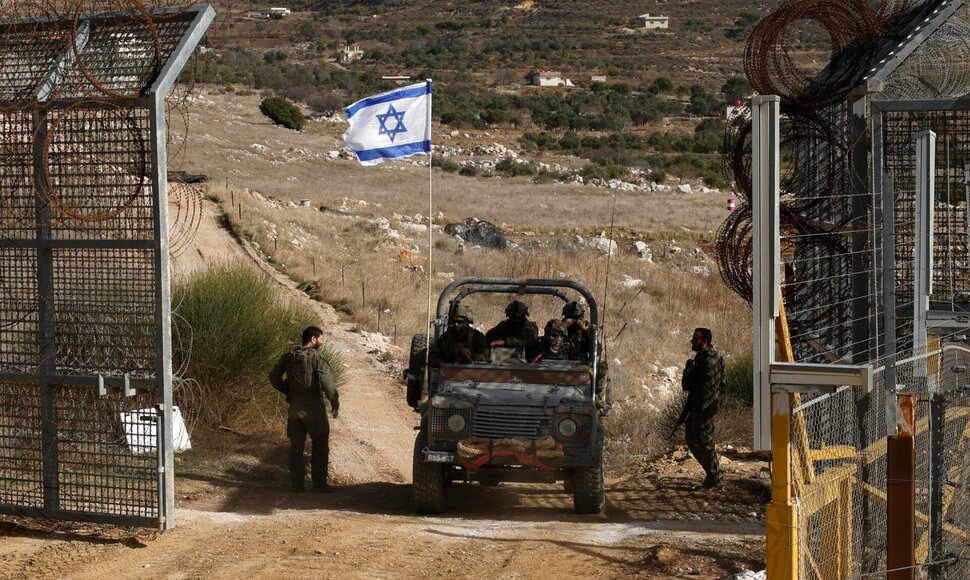 Izraelio karinės transporto priemonės Sirijoje / JALAA MAREY / AFP